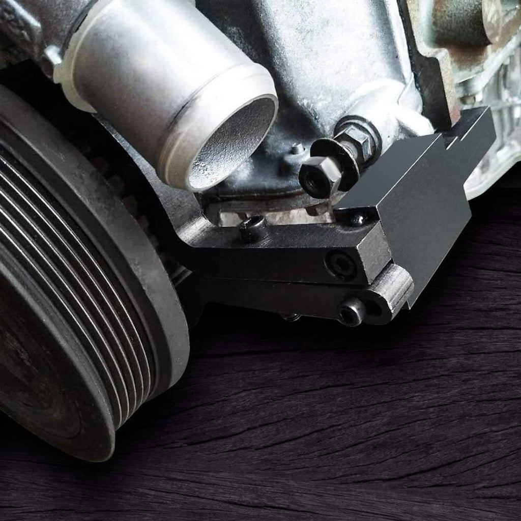 Camshaft timing tool bracket clamped at engine camshaft housing near pulley