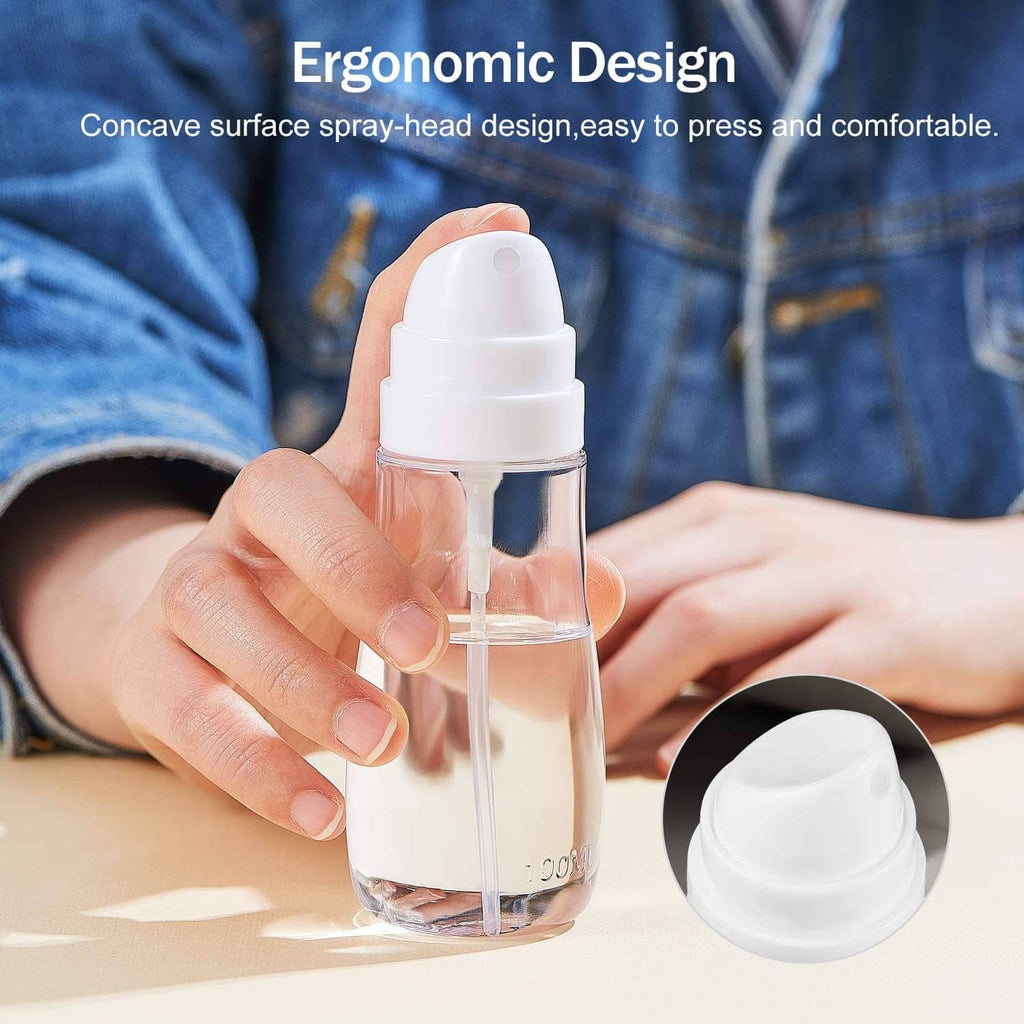 Small clear spray bottle with white ergonomic nozzle cap and open refill lid