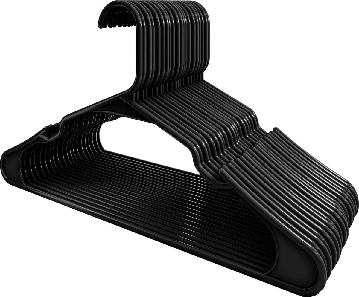 Stack of black plastic clothes hangers with curved hook and ribbed body