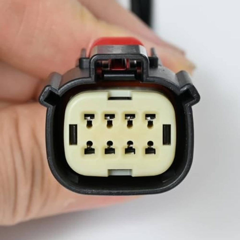 Headlight connector pigtail with multi-pin plug and red wire housing