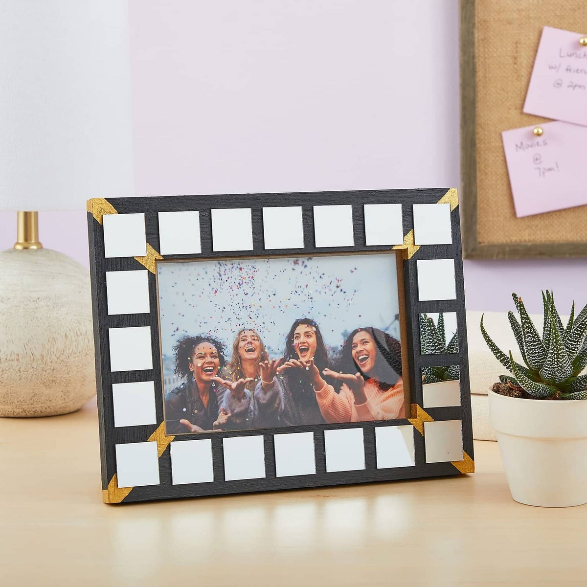 Photo frame decorated with small square glass mirror tiles around the border