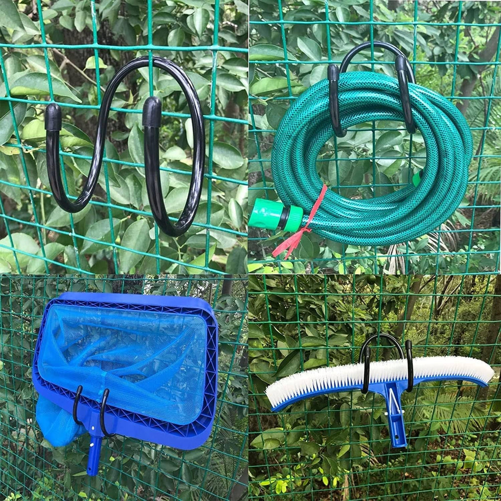 Black hose hooks holding teal garden hose coil on green mesh panel