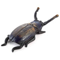 Bronze-toned cast iron beetle boot jack with curved pull handle and claw feet