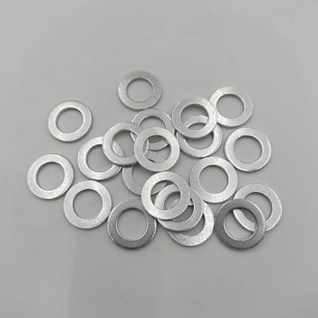 Silver crush washers, loose spread pile, circular rings with central openings
