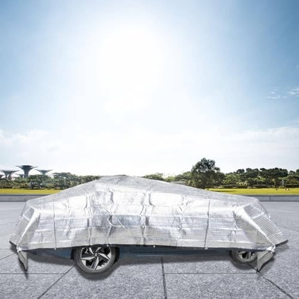 Light gray mesh cover tarp draped over a car for sun protection