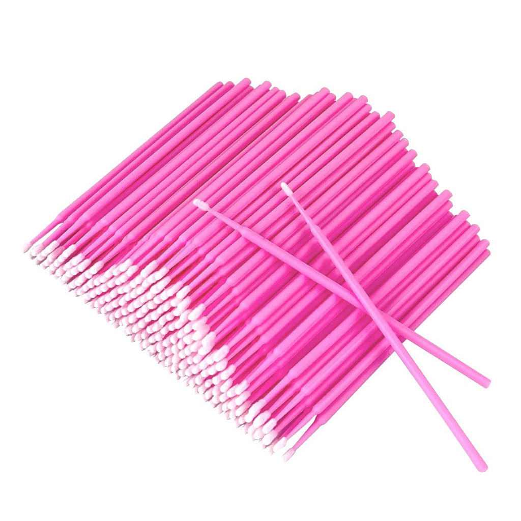 Pink foam-tipped micro swabs on slim sticks, ready for eyelash application