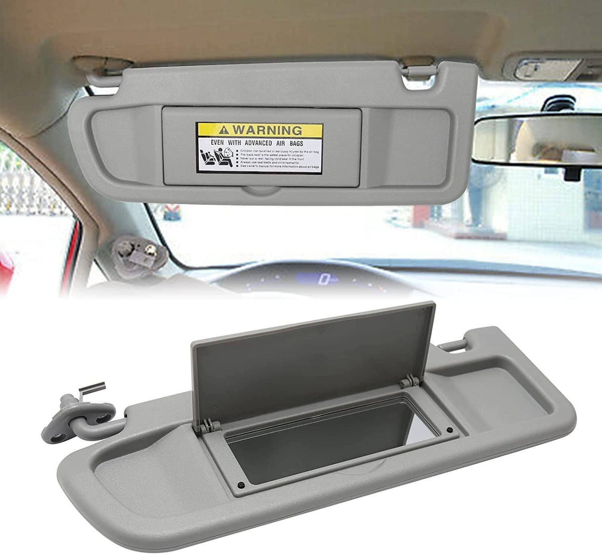 Gray sun visor with warning label, open vanity mirror compartment and mounting hinge.