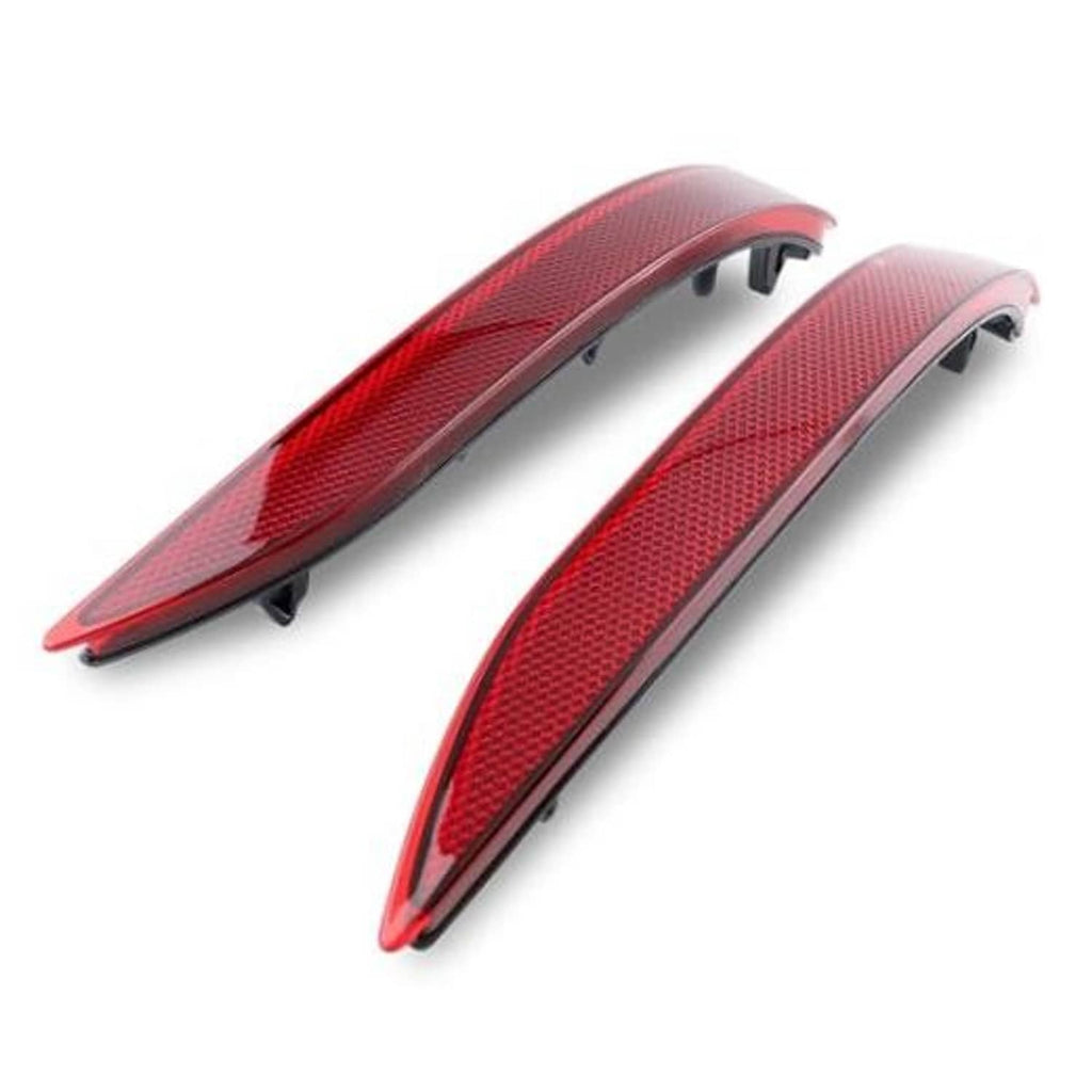 Pair of red rear bumper reflector stop lamp housings with black mounting tabs