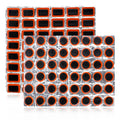 Rubber bike tire patch kit with 96 round black patches on two orange backing sheets