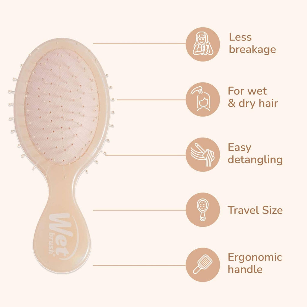 Mini detangling hair brush with translucent beige pad and flexible bristle tips