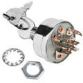 Ignition switch with grey metal housing, keys, mounting stem, and copper terminals