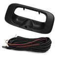 Black tailgate backup camera housing with built-in lens and wiring cable