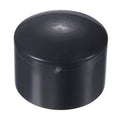 Black round UPVC pipe end cap plug fitting with smooth top and central retention nub