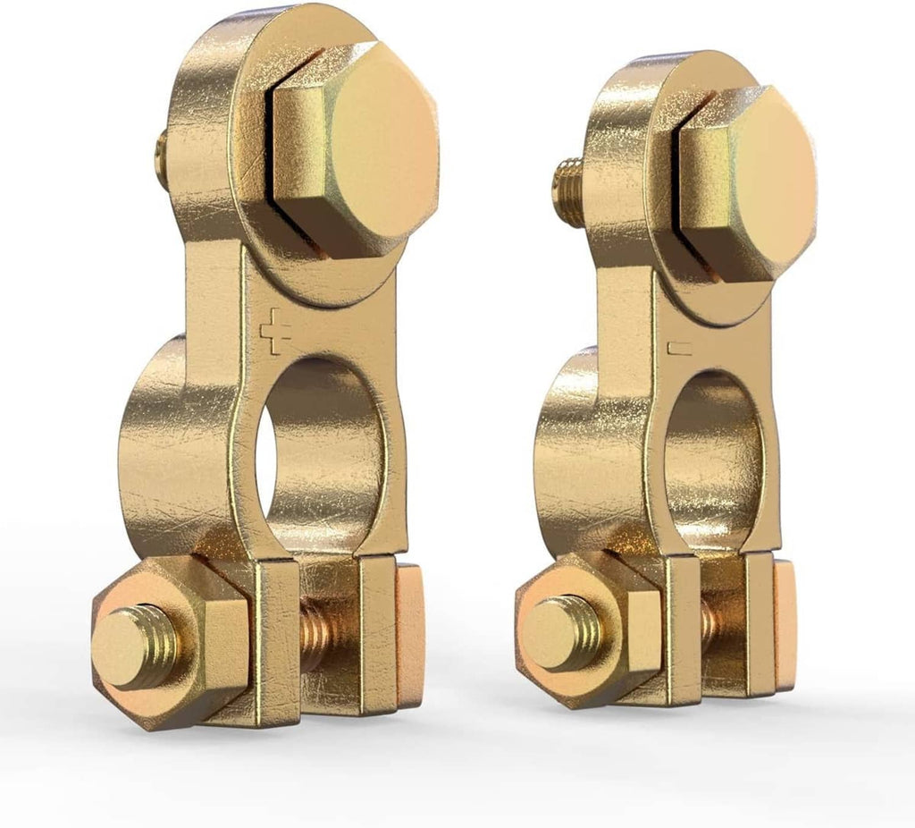 Brass battery terminal connectors with threaded bolts, one marked + and one marked -