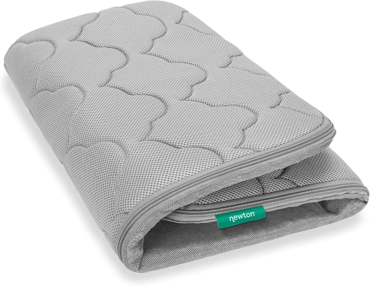 Grey breathable bassinet cover with quilted cloud pattern and silver zipper