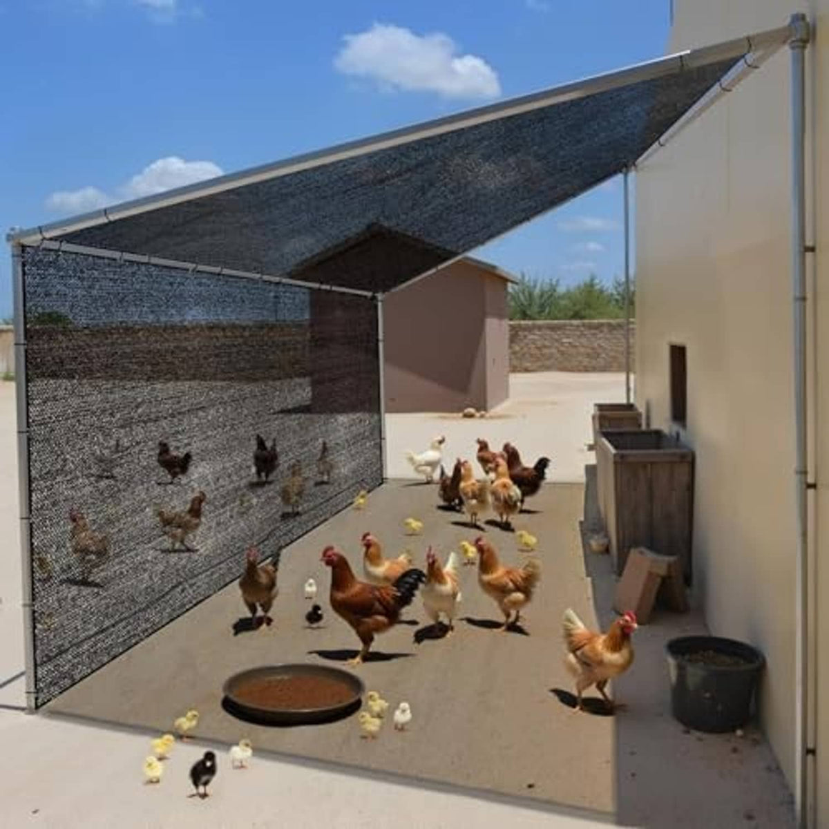 Overhead black mesh shade cloth canopy with grommets for outdoor animal enclosures