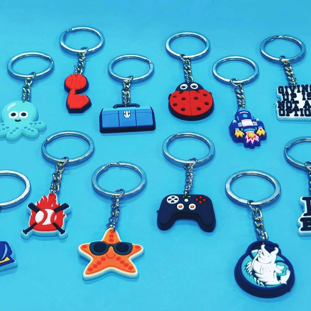 Assorted colorful character charm keychains with silver key rings