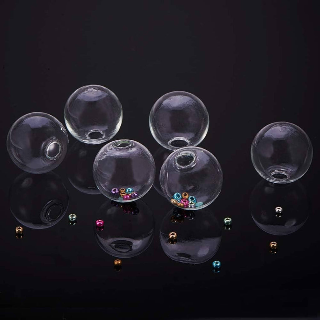 Clear glass globe bottles with metal caps, some containing colorful confetti-like pieces