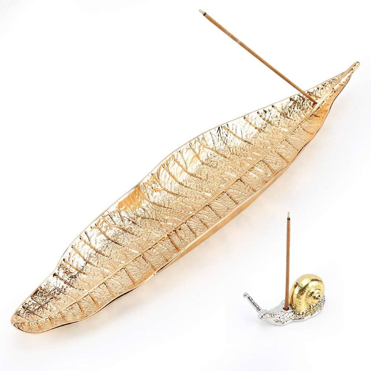 Gold leaf incense holder with etched lines and a small snail burner with incense stick