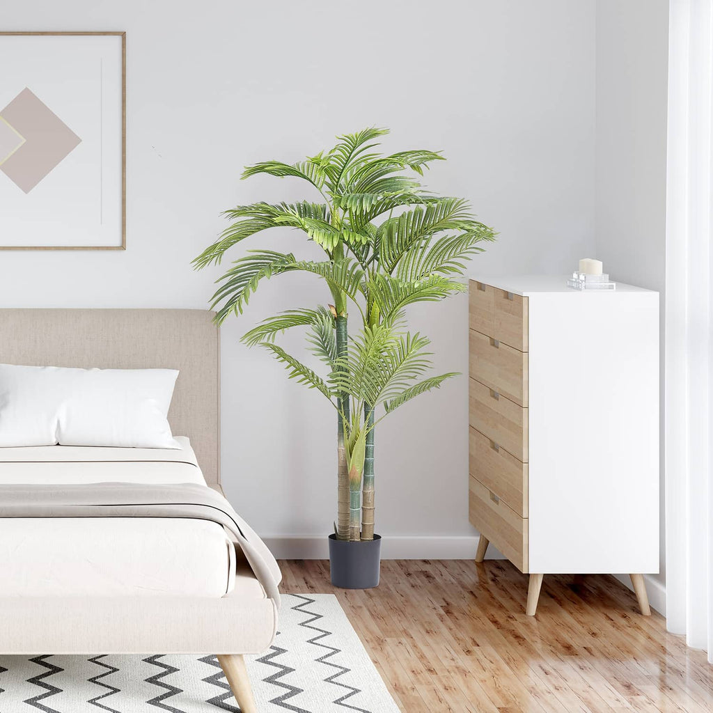 Artificial golden cane palm tree with green fronds in black pot for indoor decor
