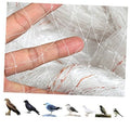 Close-up of clear bird netting mesh with small square holes stretched over fingers