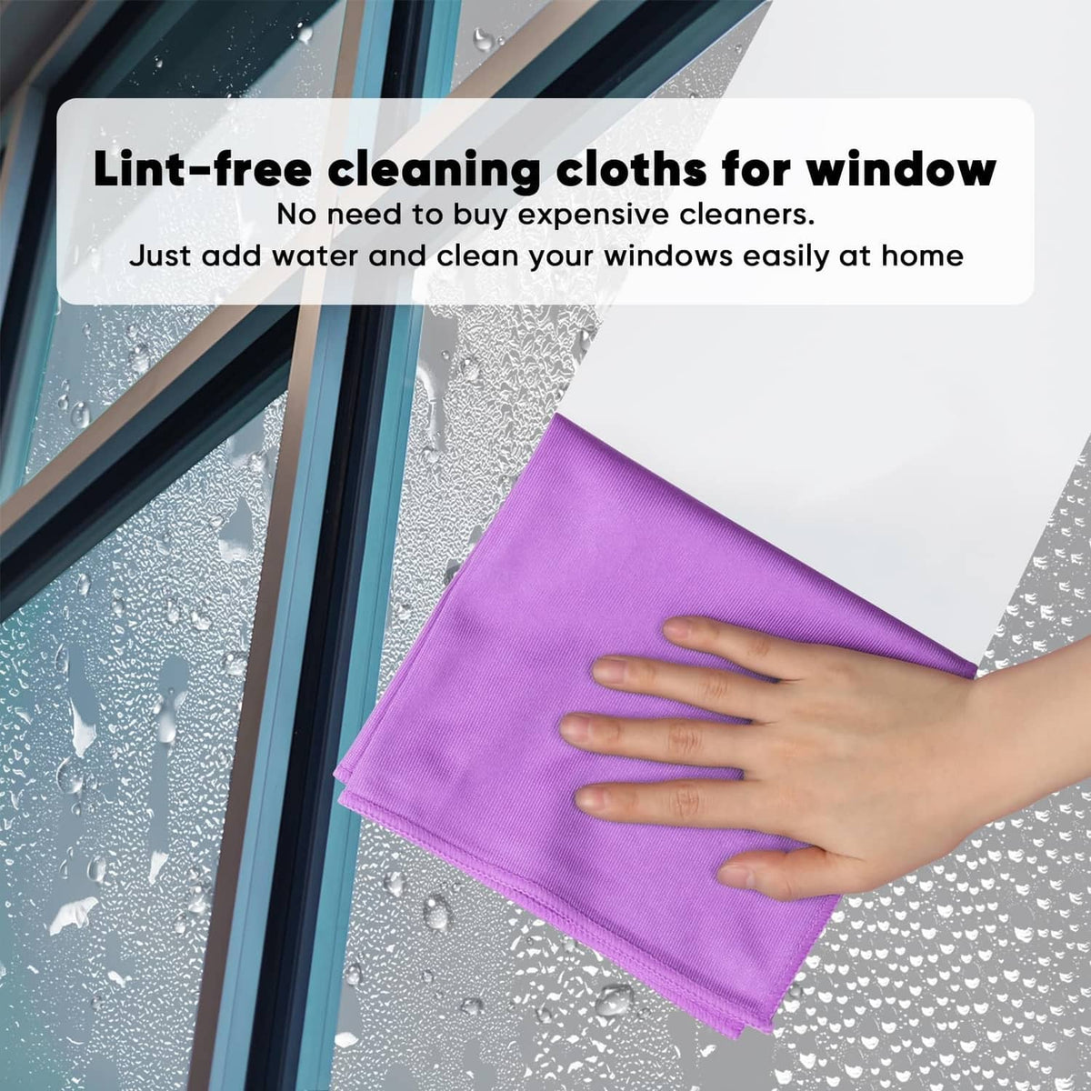 Purple microfiber cleaning cloth being used on a window surface