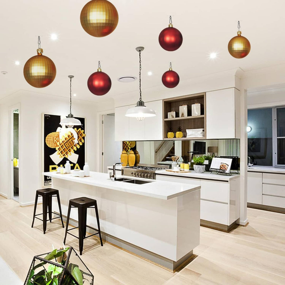 Set of stainless steel adhesive ceiling hooks holding hanging ornaments overhead