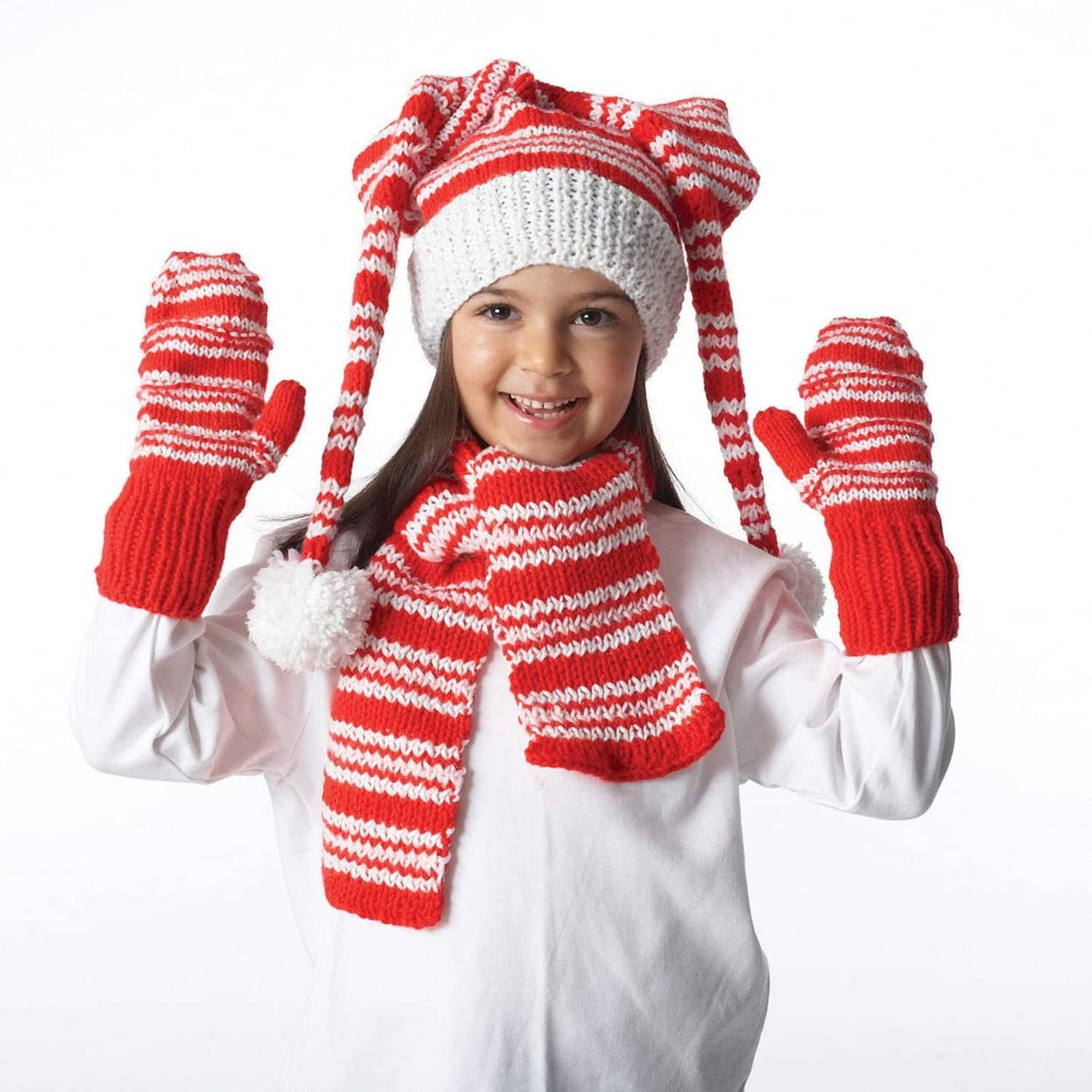 Child wearing white and red striped knit hat, scarf, and fingerless mittens