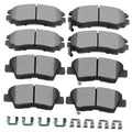 Set of eight gray ceramic brake pads with metal backing and small mounting clips