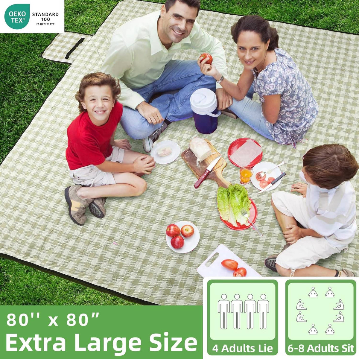 Large square green and white picnic blanket spread on grass with family.