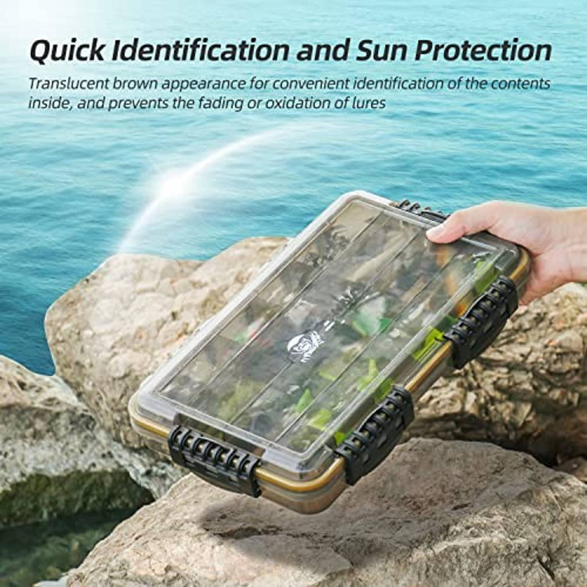 Gray waterproof tackle box with translucent lid and yellow edge, held in hand