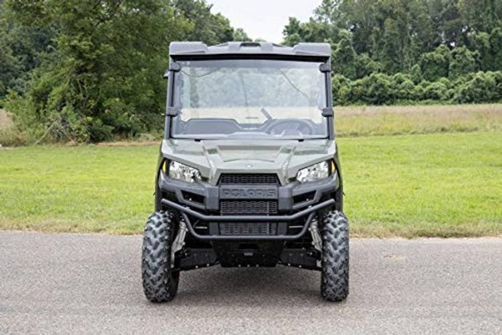 Front view of full windshield with black frame on an off-road UTV
