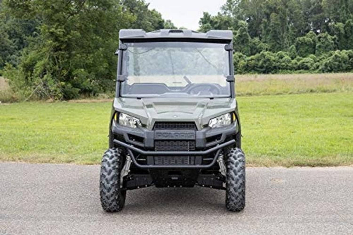 Front view of full windshield with black frame on an off-road UTV