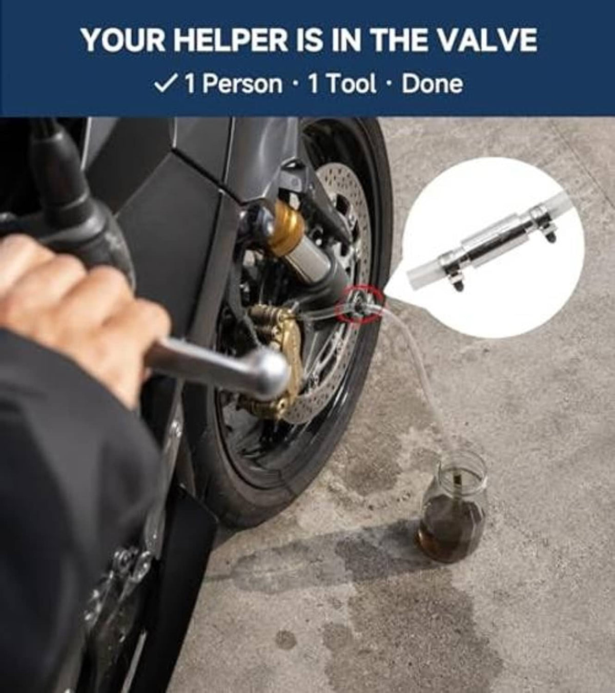 Brake bleeder tool connected to a motorcycle brake caliper with hose and fluid bottle