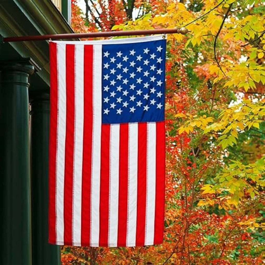 Outdoor American flag vertically hanging with red-and-white stripes and blue star field