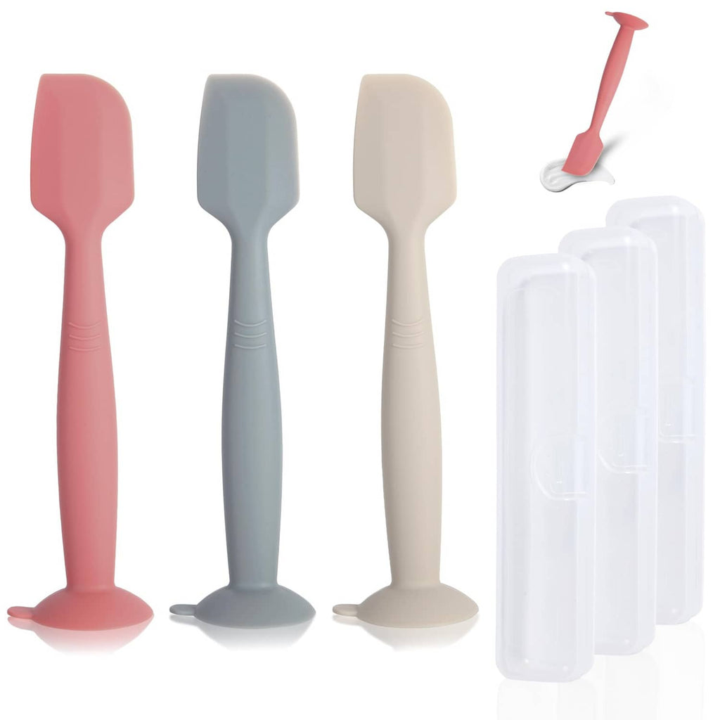 Diaper spatula set with 3 silicone tools in pink, gray, off-white and a clear case