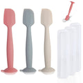 Diaper spatula set with 3 silicone tools in pink, gray, off-white and a clear case