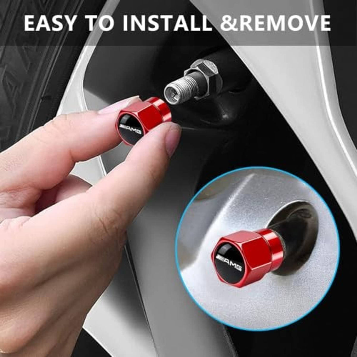 Hand installing a red metal tire valve stem cap with AMG logo on a wheel