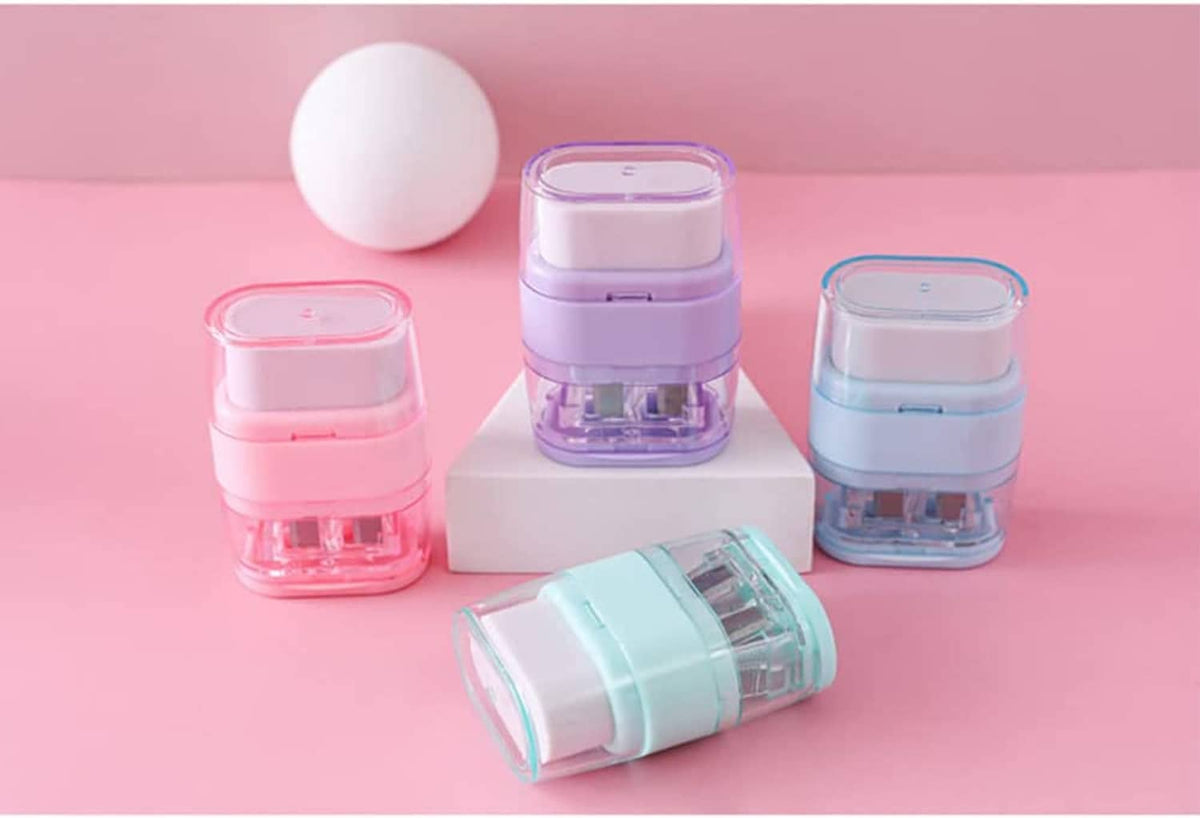 Four pastel manual pencil sharpeners on display with clear blade compartments and lids