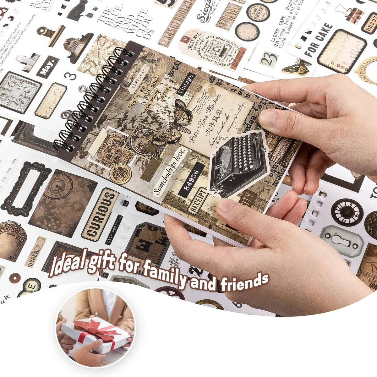 Hand holding small vintage washi sticker pieces with butterfly, receipt, and ticket designs