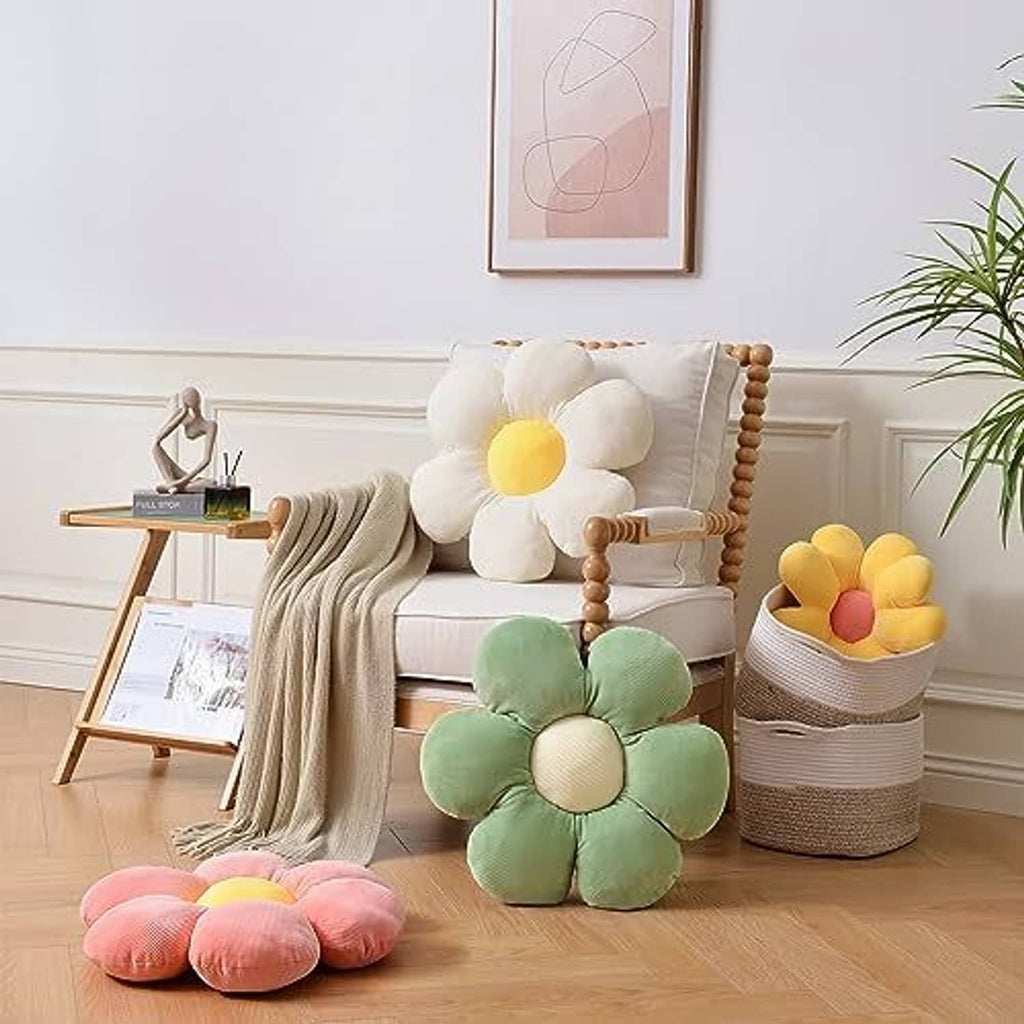 Flower shaped throw pillows in white, yellow, green, and pink