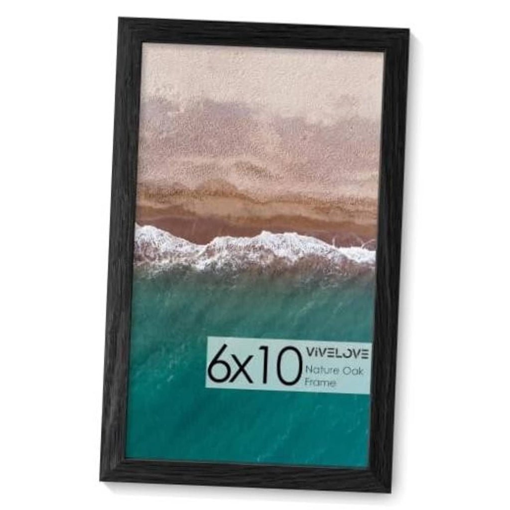 Black wood picture frame holding a seascape photo, size 6x10.