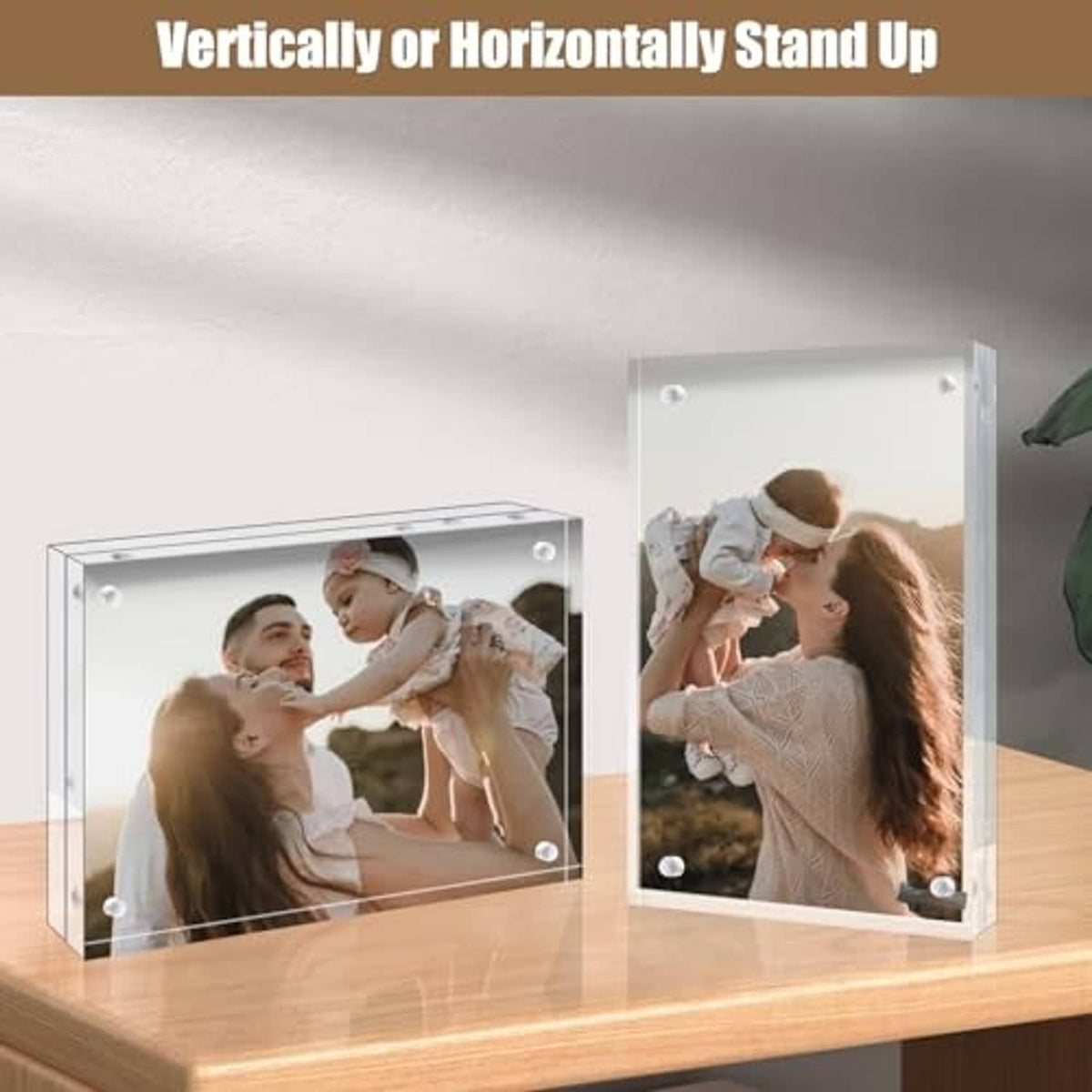 Clear acrylic frameless picture frame with rounded corner mounts, standing on table