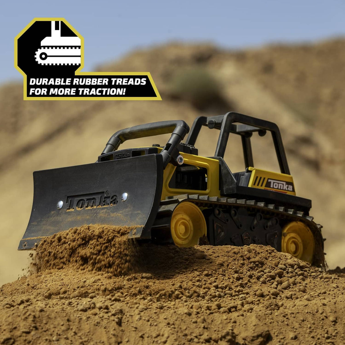 Yellow Tonka bulldozer toy with front blade and durable tread tracks