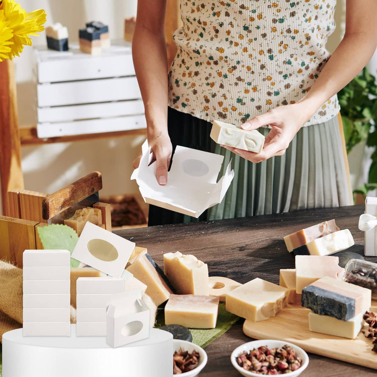 Paper soap box held in hands for packing homemade bar soap