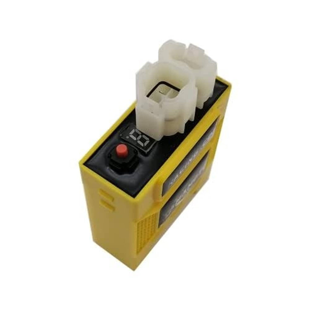 Yellow CDI ignition module showing top white connector and black control module