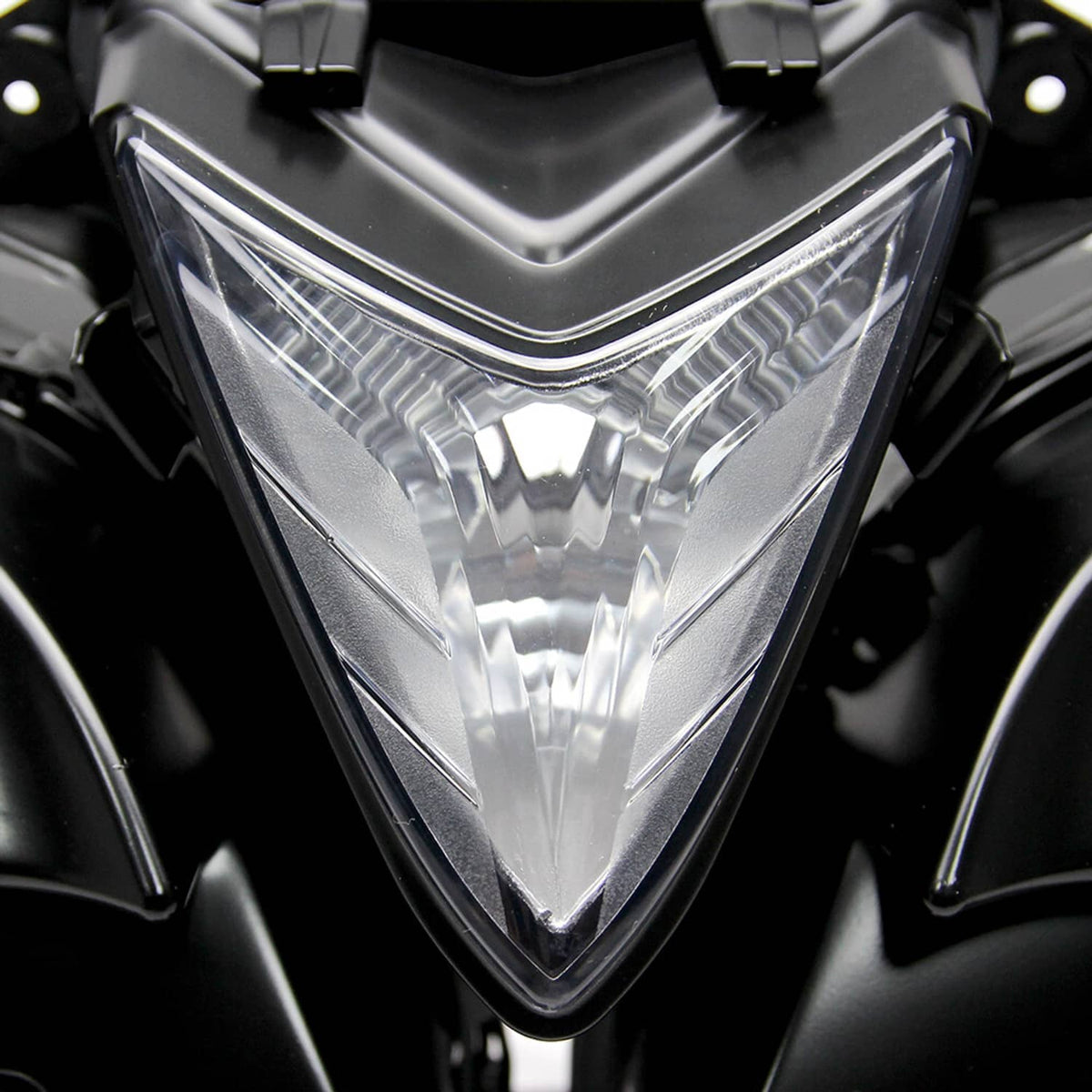 Clear lens headlight assembly with black housing and triangular reflector design