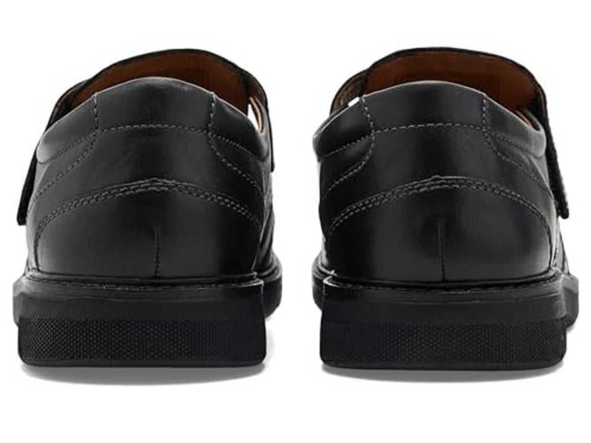 Black leather casual shoes back view with cushioned heel and stitched seams