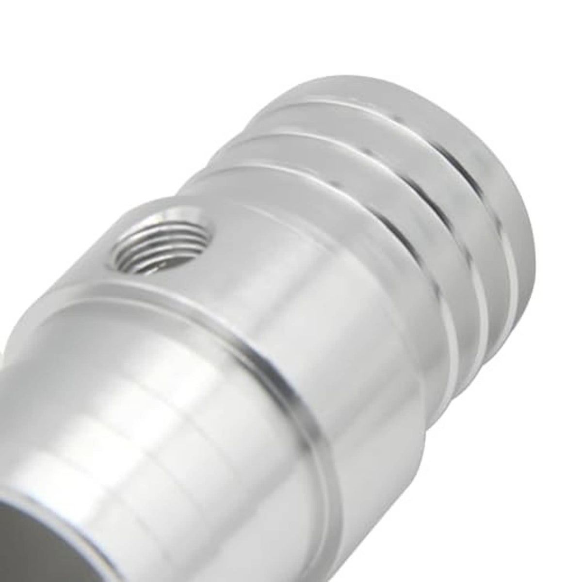 Close-up of radiator hose barb adapter threads near the port, silver finish.