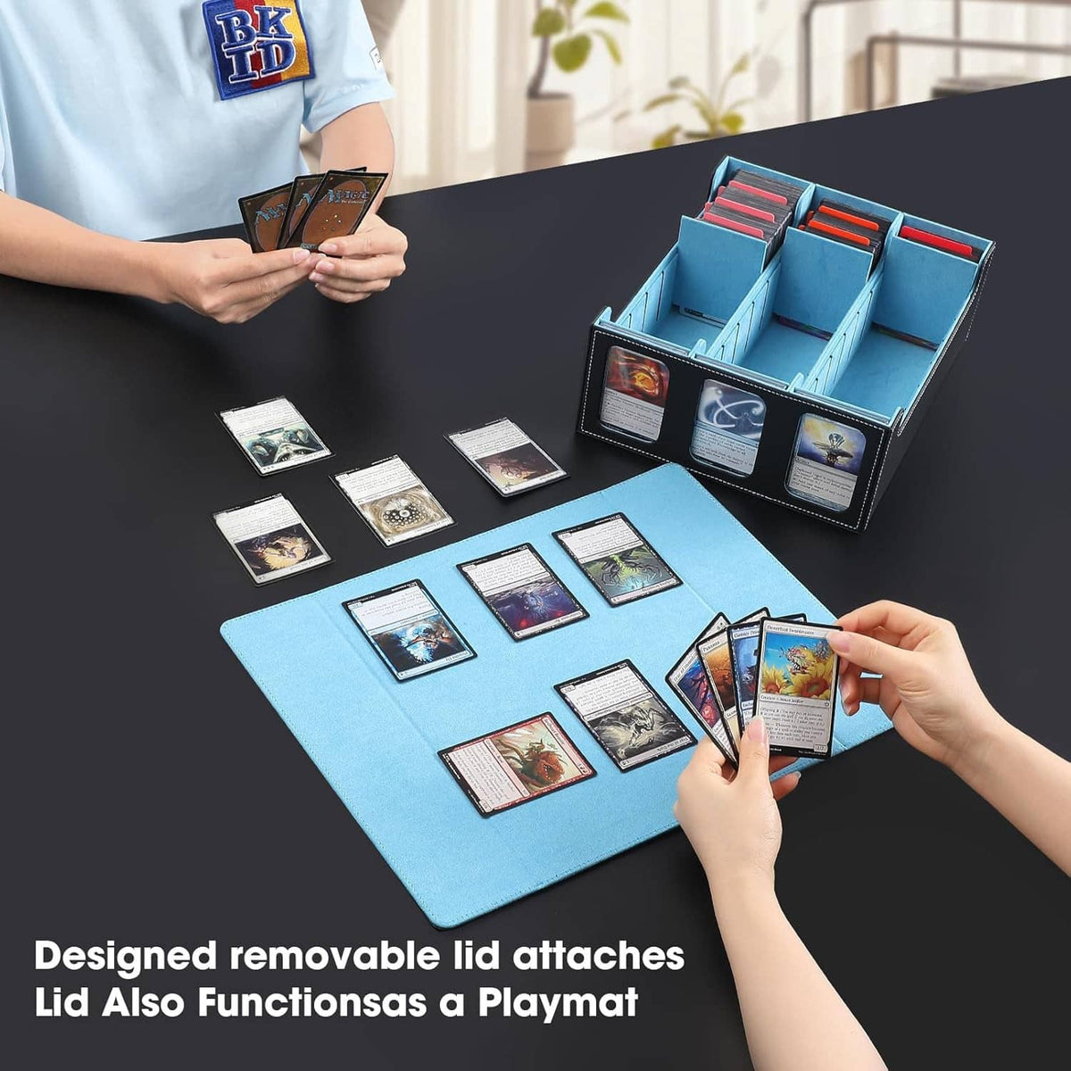 Trading card storage box open with blue organizer trays and divider slots for card sorting